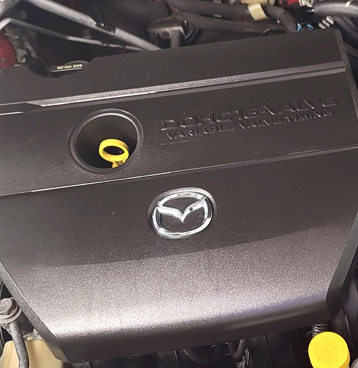 Dusty Mazda engine before cleaning